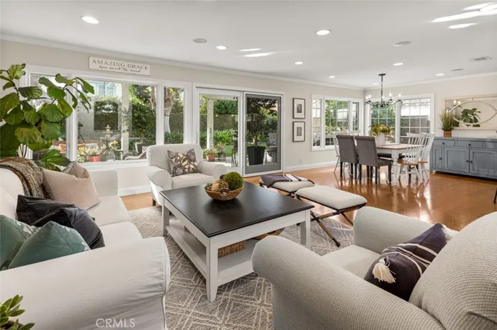The living space downstairs offers unobstructed flow between the living room, dining room and kitchen.