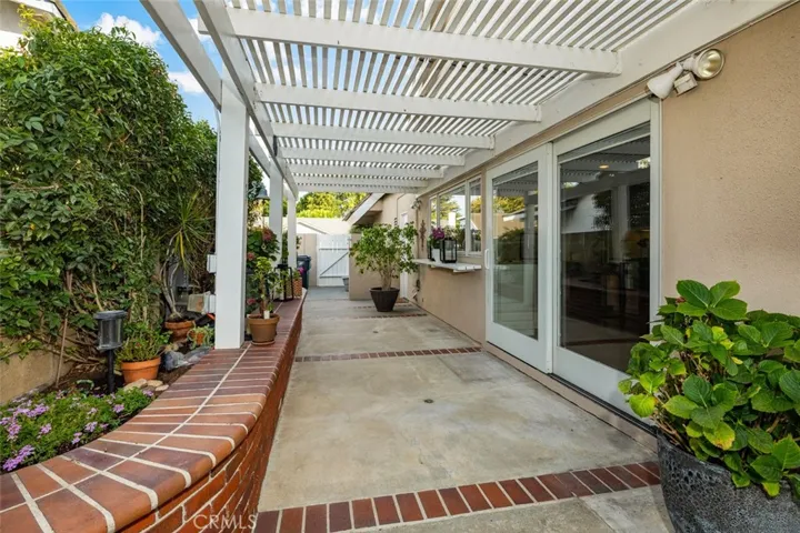 The wide side yard is connected to the dinning room and kitchen windows.