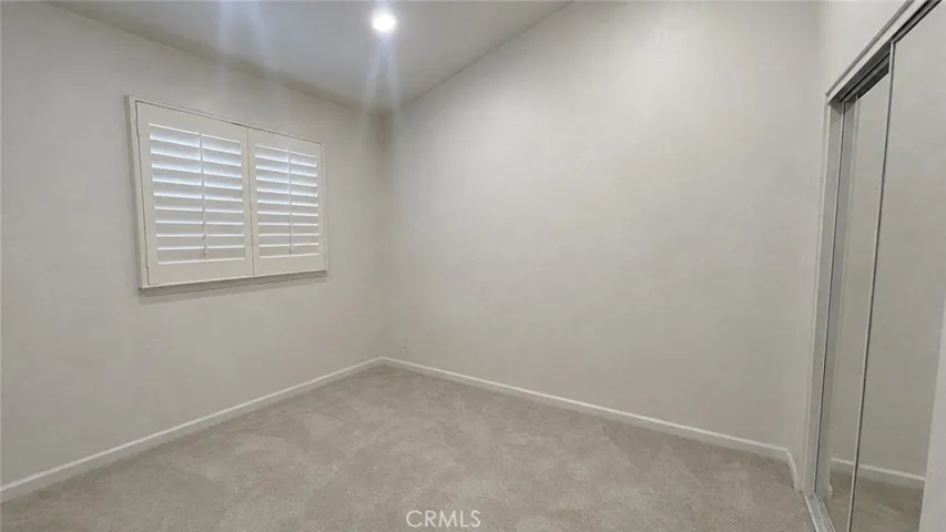 This image has been digitally altered using AI tools to remove furniture and personal clutter only. Structural features and physical condition have not been modified.