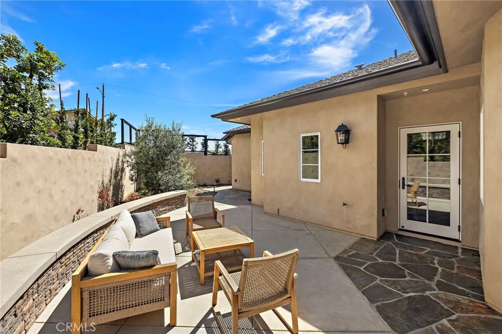 Backyard and back patio area is fully fenced, landscaped, and hardscaped. Backyard and back patio area is fully fenced, landscaped, and hardscaped.