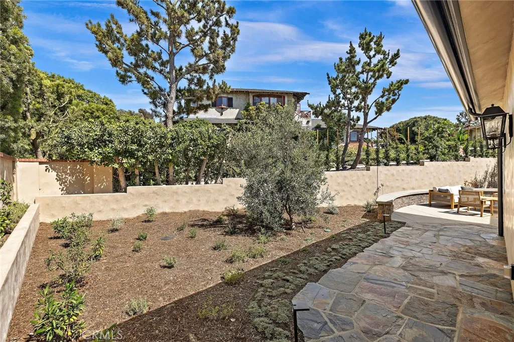 Backyard and back patio area is fully fenced, landscaped, and hardscaped. Backyard and back patio area is fully fenced, landscaped, and hardscaped.