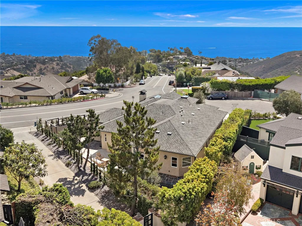 Aerial view looking at the back of the property. Easy distance to the beach and town. Aerial view looking at the back of the property. Easy distance to the beach and town.