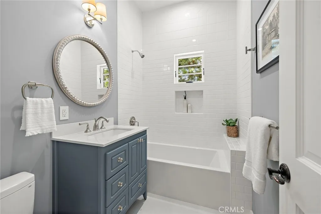 Full hall bathroom with Toto toilet, Strasser vaniet, GITU white matte flooring, and Sydney Acrylic bathtub. Full hall bathroom with Toto toilet, Strasser vaniet, GITU white matte flooring, and Sydney Acrylic bathtub.