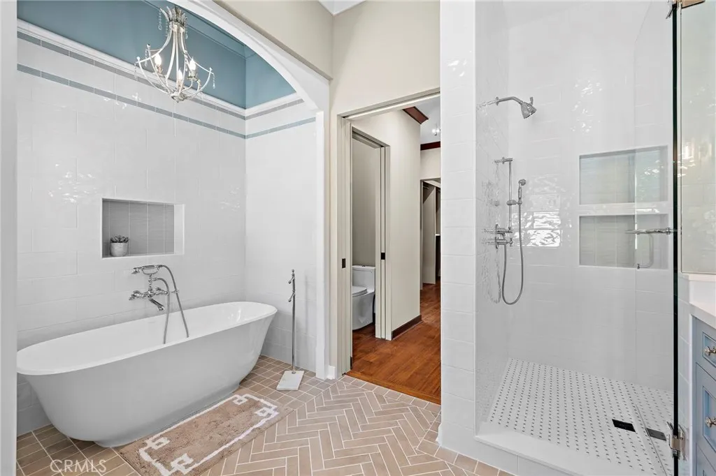 Victoria and Albert Amiata soaking tub and walk-in shower with Onda Gloss White walls and Sheet Basketweave flooring Victoria and Albert Amiata soaking tub and walk-in shower with Onda Gloss White walls and Sheet Basketweave flooring