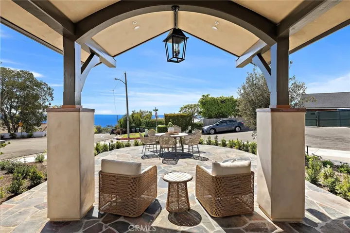 Expansive covered front patio for easy indoor,outdoor living.