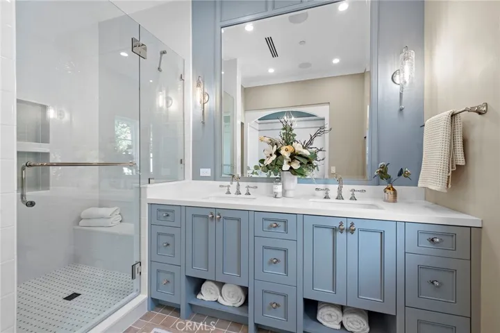 Primary bath with Toto toilet, Newport Brass faucets, Quartz counters, and gorgeous Argile Siena tile flooring