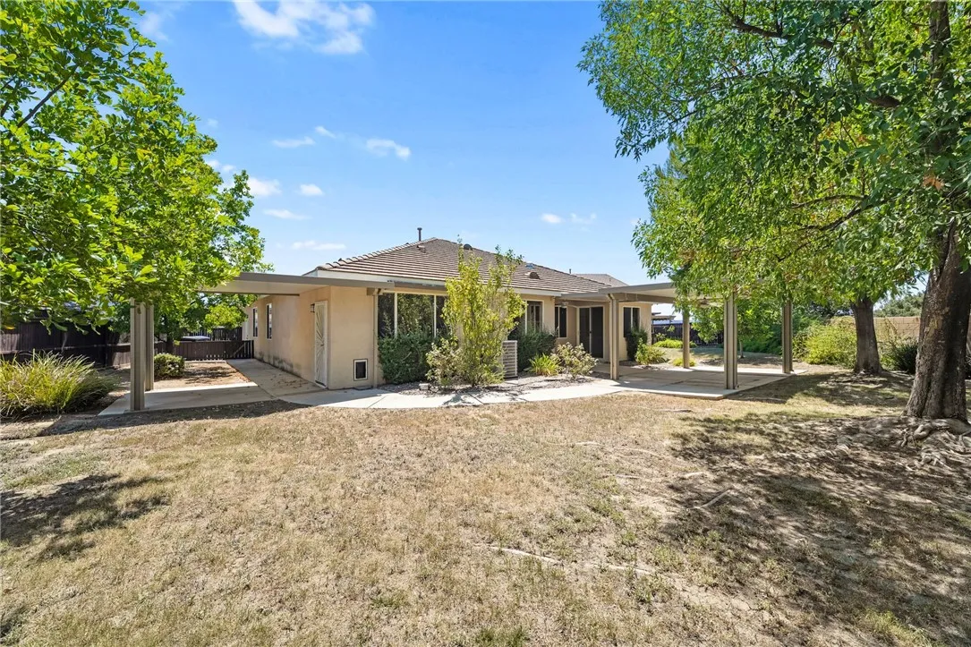 Rear of home showing main covered patio and primary suite covered patio. Rear of home showing main covered patio and primary suite covered patio.