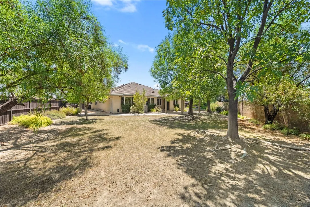 Rear of home with mature shade trees Rear of home with mature shade trees