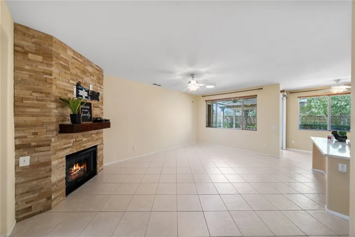 Open family room with custom fireplace and mantle