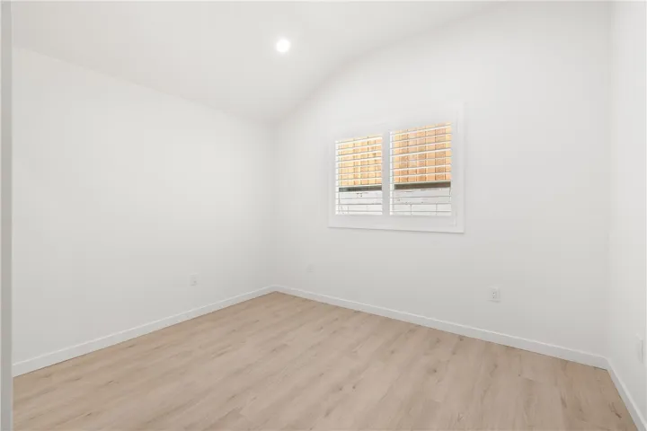 Large secondary bedroom with high ceilings