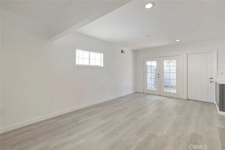 formal dining room with double French doors leading to back yard