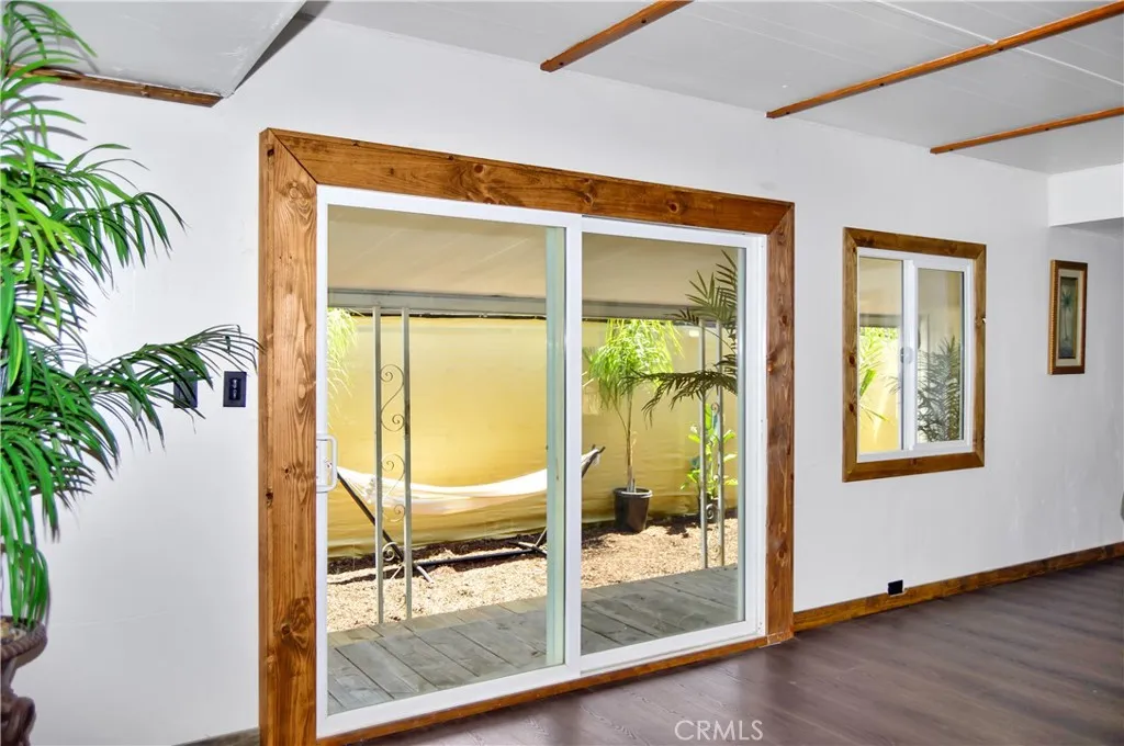 Keyed-Access Sliding Glass Door Allows Entry through the Front Gate and Provides Views of the Deck from the Great-Room-Style Living Room and Kitchen Keyed-Access Sliding Glass Door Allows Entry through the Front Gate and Provides Views of the Deck from the Great-Room-Style Living Room and Kitchen