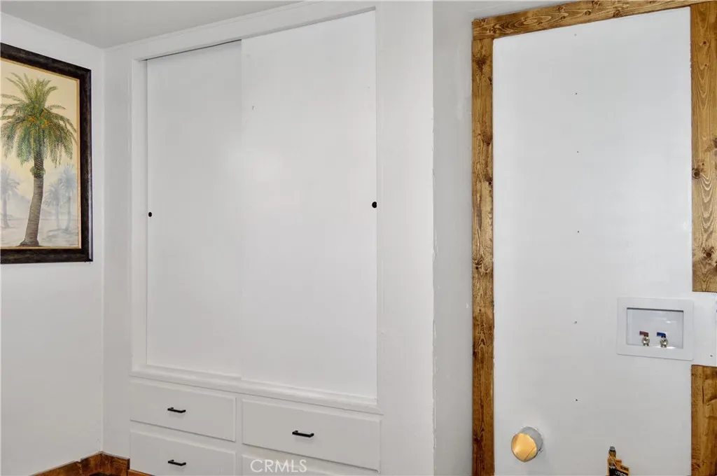 The 2nd Bedroom is Accessed via the Main Bedroom and Offers More Closet Space with Drawers Below, Hook-ups for a Stackable Washer/Dryer, and Another Sliding Entry Door The 2nd Bedroom is Accessed via the Main Bedroom and Offers More Closet Space with Drawers Below, Hook-ups for a Stackable Washer/Dryer, and Another Sliding Entry Door
