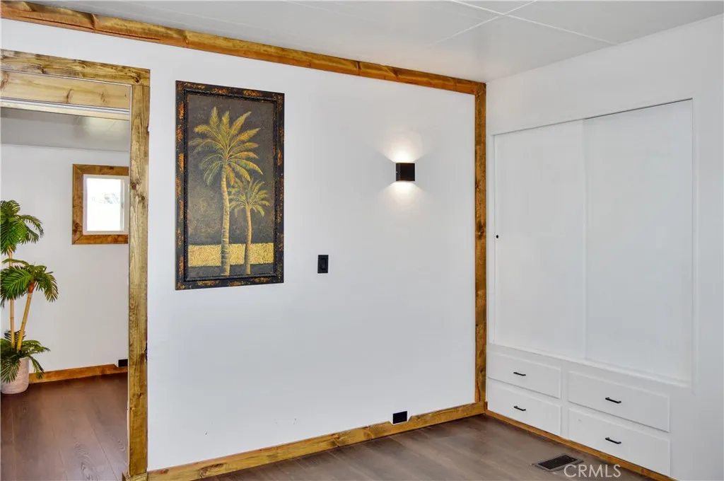 The Main Bedroom Next Door has a Barn Door Entry, Modern Lighting, Dual Closets with Drawers Below, and More Storage Hidden Behind the Barn Door The Main Bedroom Next Door has a Barn Door Entry, Modern Lighting, Dual Closets with Drawers Below, and More Storage Hidden Behind the Barn Door