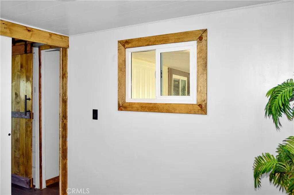 The 2nd Bedroom is Accessed via the Main Bedroom and Offers More Closet Space with Drawers Below, Hook-ups for a Stackable Washer/Dryer, and Another Sliding Entry Door The 2nd Bedroom is Accessed via the Main Bedroom and Offers More Closet Space with Drawers Below, Hook-ups for a Stackable Washer/Dryer, and Another Sliding Entry Door