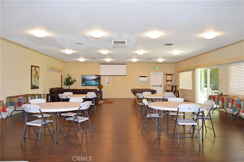 Inside the clubhouse, there's a pool table, cozy lounge area, dining tables, full kitchen and activities to enjoy with new friends (TV screen simulated) Inside the clubhouse, there's a pool table, cozy lounge area, dining tables, full kitchen and activities to enjoy with new friends (TV screen simulated)