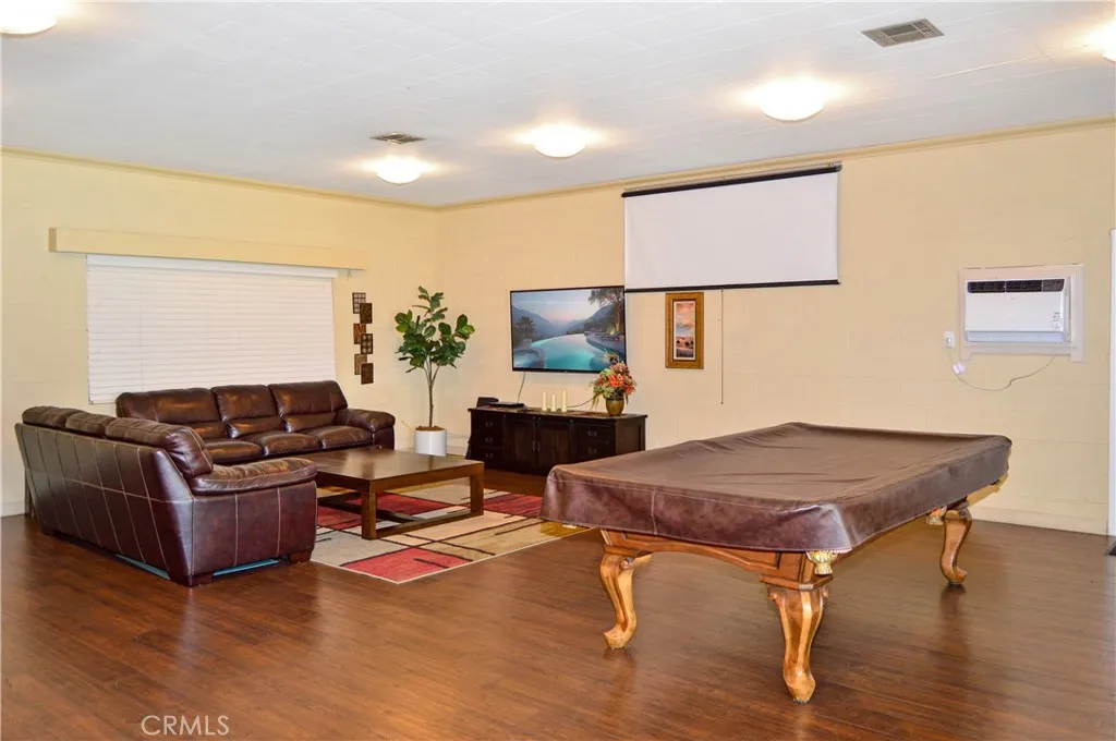Inside the clubhouse, there's a pool table, cozy lounge area, dining tables, full kitchen and activities to enjoy with new friends (TV screen simulated) Inside the clubhouse, there's a pool table, cozy lounge area, dining tables, full kitchen and activities to enjoy with new friends (TV screen simulated)