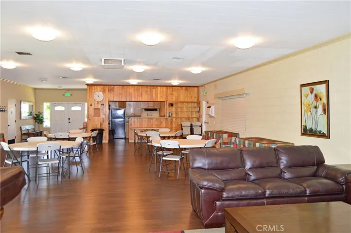 Inside the clubhouse, there's a pool table, cozy lounge area, dining tables, full kitchen and activities to enjoy with new friends