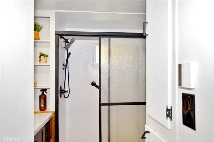 First Stop is the Remodeled Bath with a Fancy Controller for the Fan/Light/Heater Combo and Linen Cabinets at the Entry