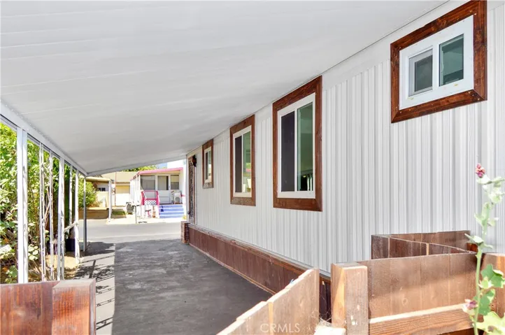 Side Yard Gate to Extra-Long Covered Carport with Tandem Parking for Two Cars