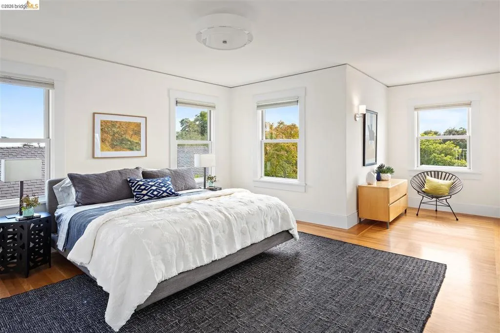 Hardwood flooring, multiple windows, recessed lighting, wall sconce, and crown molding Hardwood flooring, multiple windows, recessed lighting, wall sconce, and crown molding