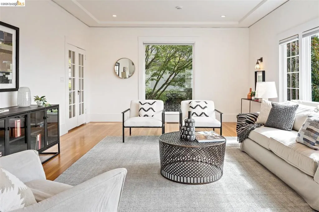 Hardwood flooring, coved ceilings, French doors, and ample natural light from multiple windows Hardwood flooring, coved ceilings, French doors, and ample natural light from multiple windows