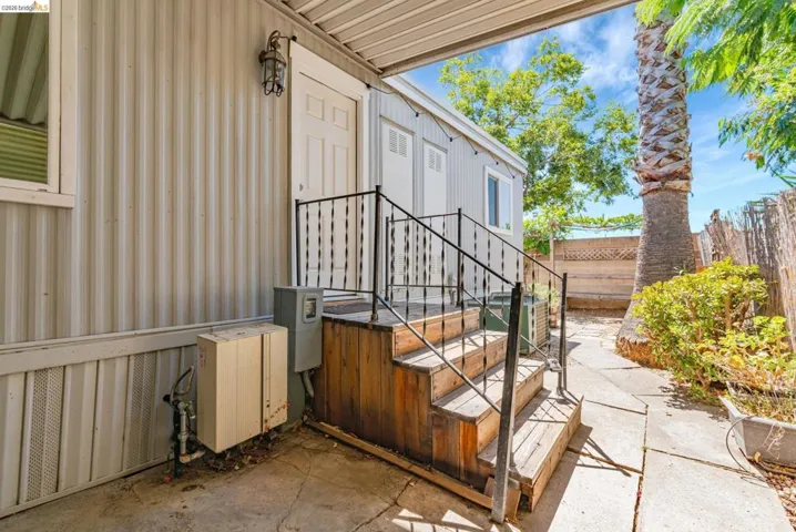 Property entrance with a patio
