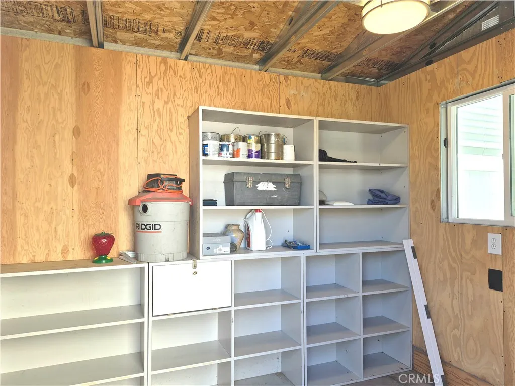Interior of the shed has electricity and lots of storage shelves. Interior of the shed has electricity and lots of storage shelves.