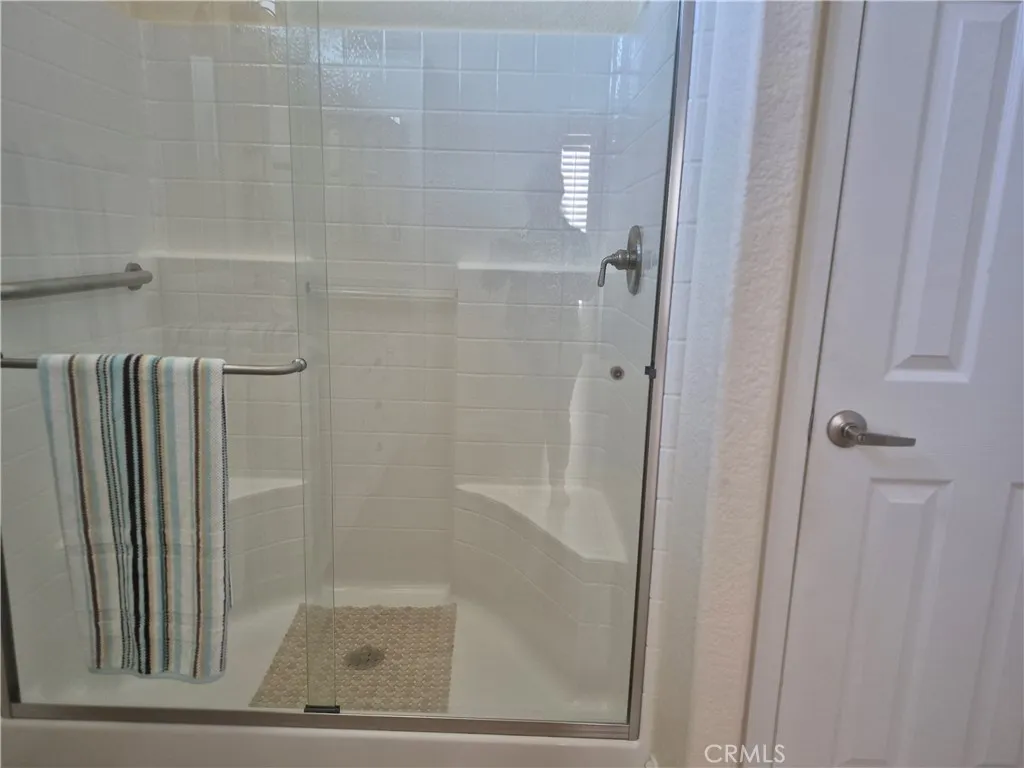 Large walk-in shower with seating. Large walk-in shower with seating.
