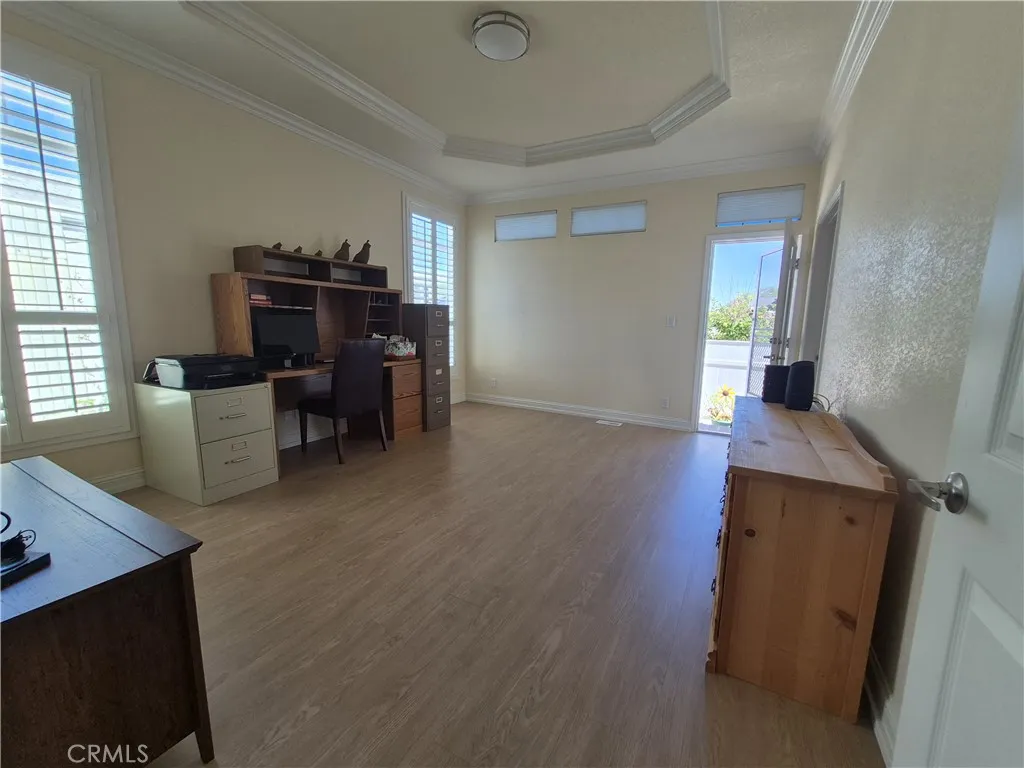 Primary bedroom opens to back patio via French door. Primary bedroom opens to back patio via French door.