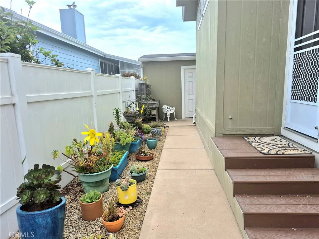 Lovely tinted cement walkway at front door. Lovely tinted cement walkway at front door.