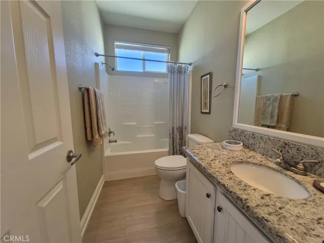 Guest bathroom with tub and shower.