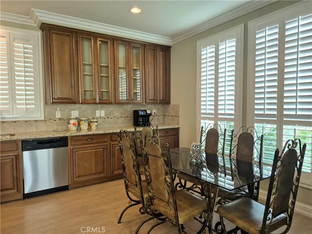 Stainless steel appliances and ample dining area.