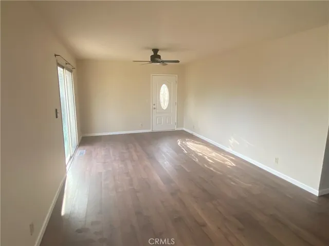 Living area is at rear of property opening to fenced backyard