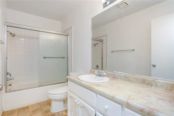 Bathroom has shower over tub
