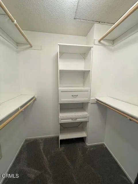 Primary bedroom walk in closet Primary bedroom walk in closet