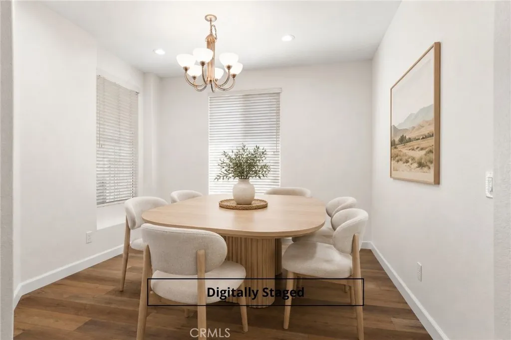 Formal dining room digitally staged or optional den if you prefer to eat in kitchen Formal dining room digitally staged or optional den if you prefer to eat in kitchen