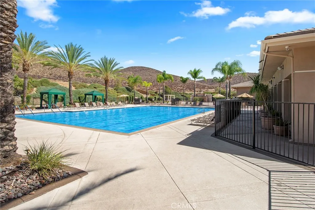 Resort style community pool complete with palms & cabanas around the perimeter Resort style community pool complete with palms & cabanas around the perimeter