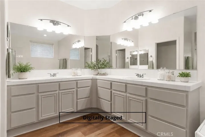 Expansive primary bath has a recent glow up + double vanities and sinks - so much counter space!