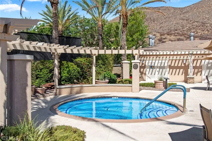 Community jacuzzi & bathhouse with stunning mountain backdrop