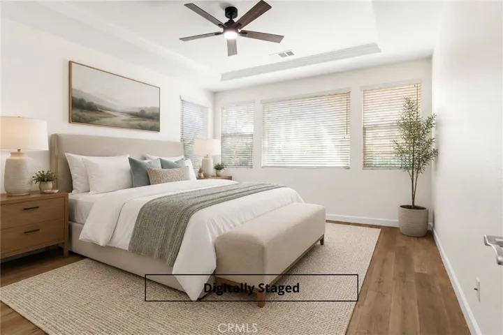 Quiet & cozy primary bedroom gets lots of natural light
