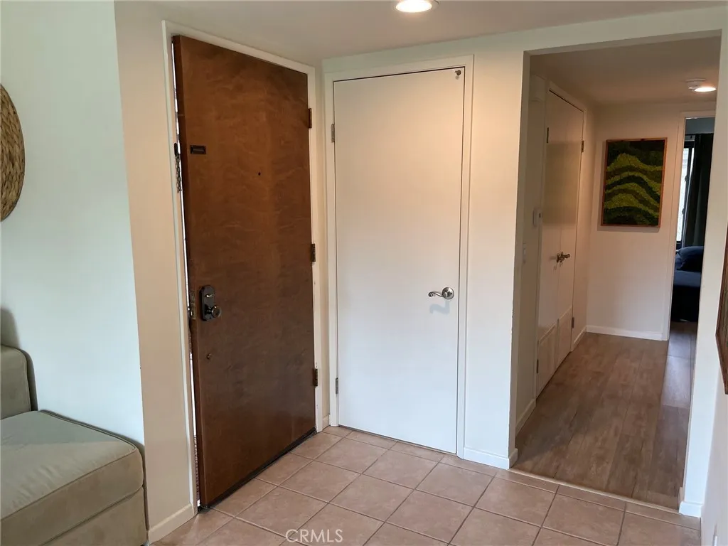 Entry to condo with coat closet Entry to condo with coat closet