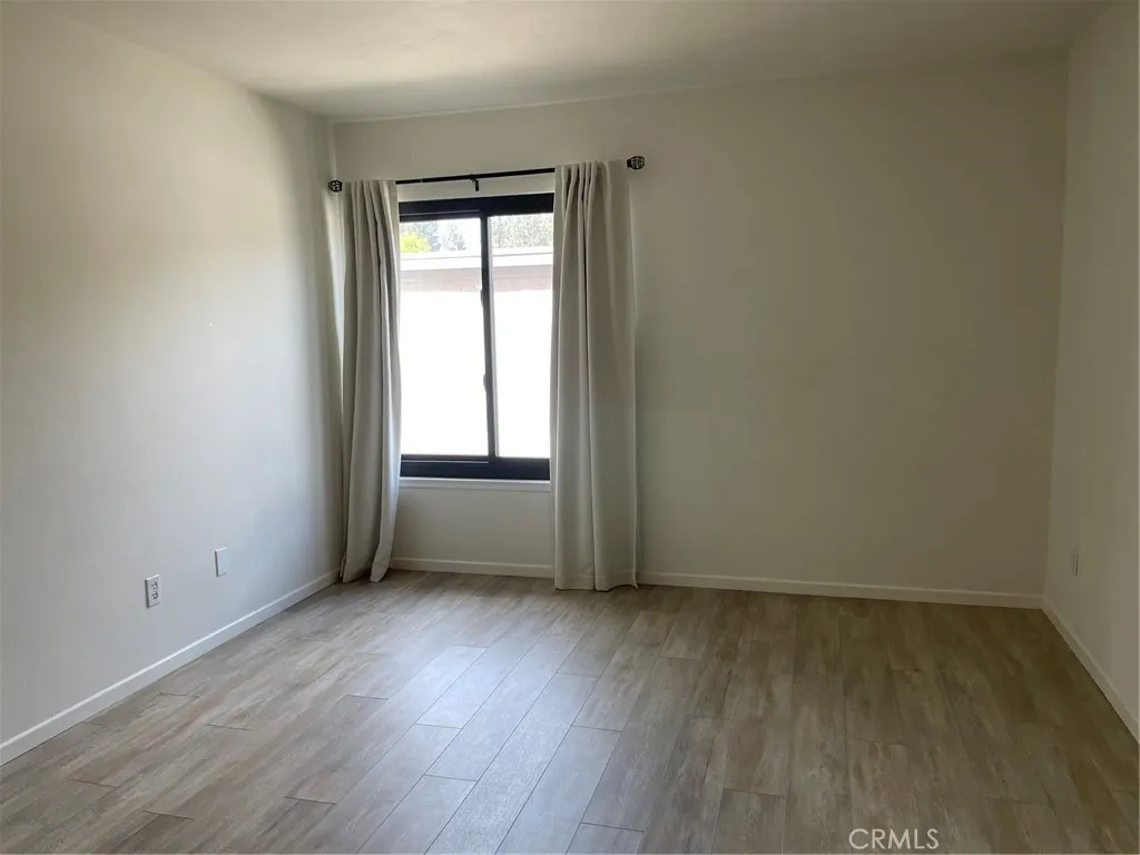 Main bedroom with vinyl planks flooring Main bedroom with vinyl planks flooring
