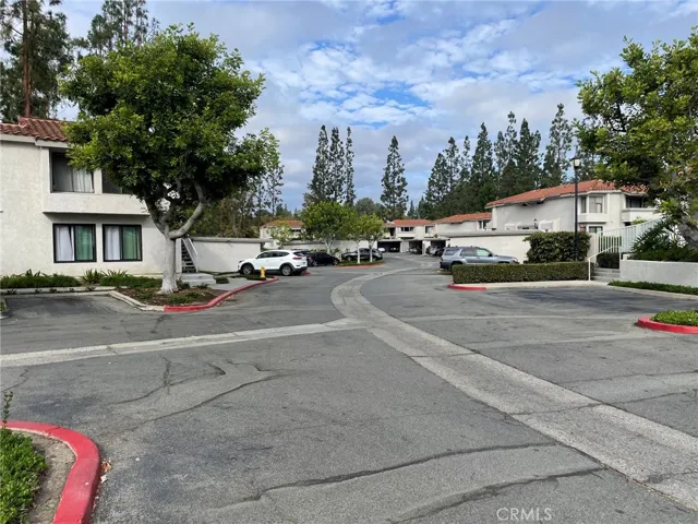 Many parking spaces in complex during the day