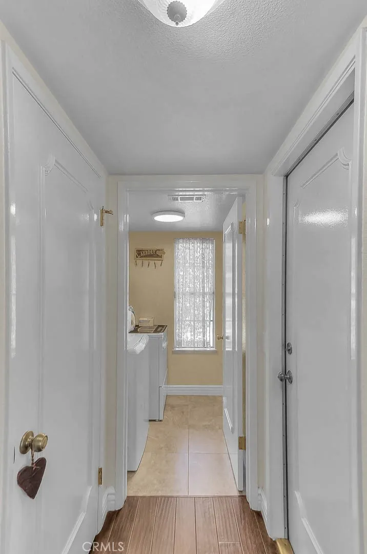 Door from garage leads to closet & laundry area Door from garage leads to closet & laundry area