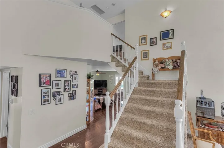 Stairway to primary and 2 secondary bedrooms