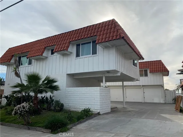 Upper unit from street view, above garages, stand alone.