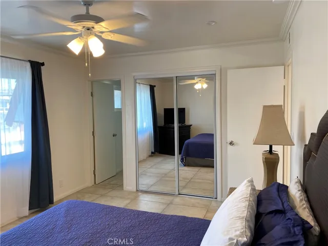 Primary bedroom with entrance to private bathroom.