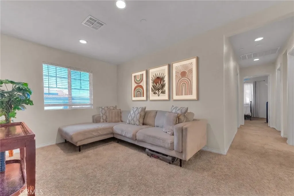Bright and inviting loft/den with an open layout, perfect for work, hobbies, or a cozy retreat.