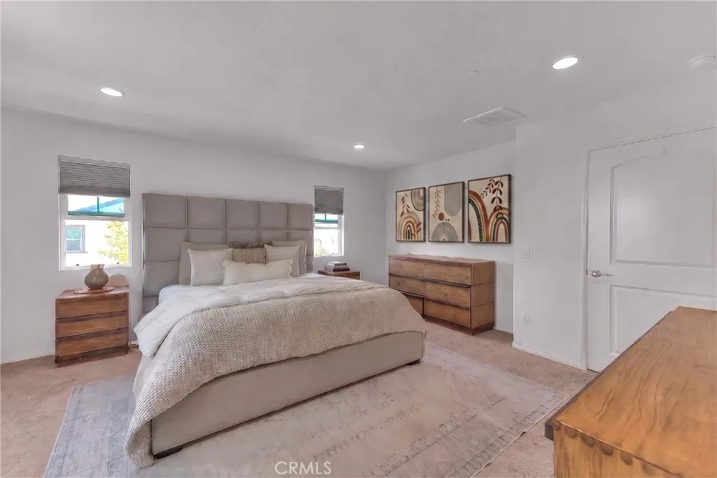 Private master retreat with a spacious layout and warm, inviting ambiance.